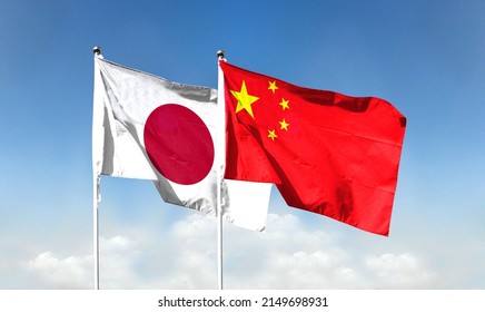 Chinese flag and Japanese flag with blue sky. waving blue sky - Shutterstock ID 2149698931