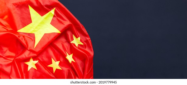 Chinese Flag On Dark Background.
