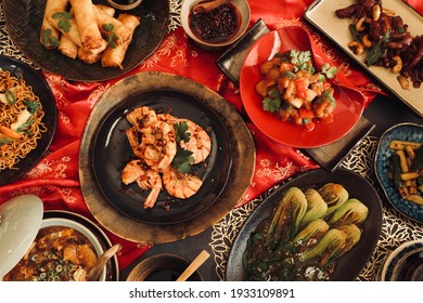Chinese Food Feast. Assorted popular Chinese food for dinner gathering. - Shutterstock ID 1933109891