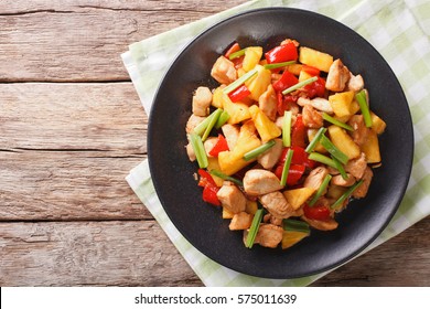 Chinese food: fried chicken with pineapple in sweet and sour sauce closeup on the table. horizontal view from above
 - Shutterstock ID 575011639
