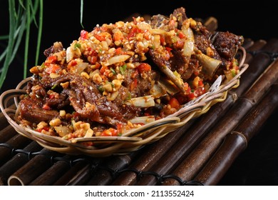 Chinese food, spicy food, delicious food, hand grasping lamb chops