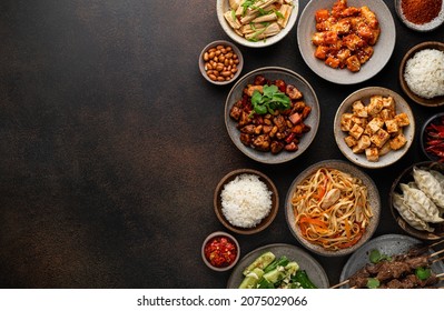 chinese food, chinese traditional cuisine dishes on dark background, top view, copy space - Shutterstock ID 2075029066