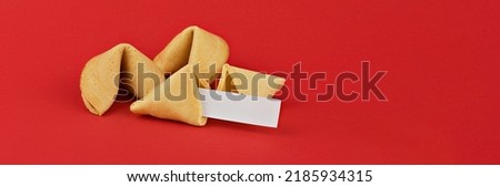 Chinese fortune cookies. Cookies with empty blank inside for prediction words. Isolated on red background