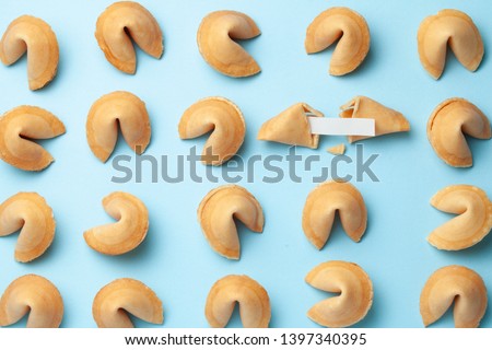 Chinese fortune cookies. Cookies texture pattern with empty blank inside for word prediction. Blue background