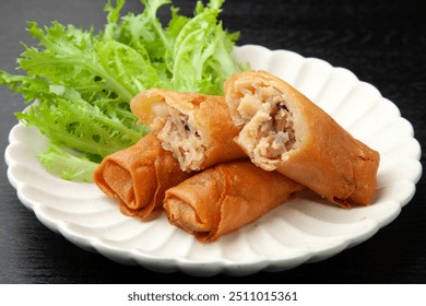 Chinese fried spring rolls cut in half - Powered by Shutterstock