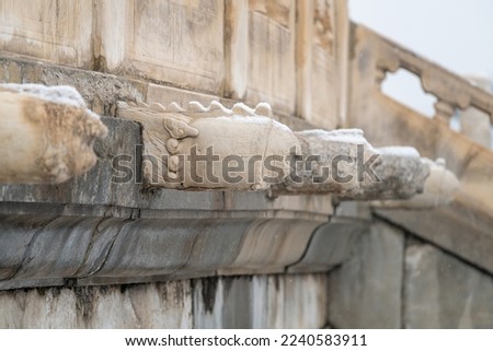 Chinese gargoyles, made of white marble, part of the drainage system of the Temple of Heaven in Beijing. Those gargoyles on the second floor of the temple base are curved like phenix heads.