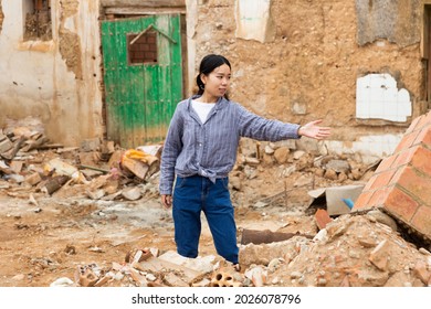 Chinese Girl Near Damaged Building After Earthquake