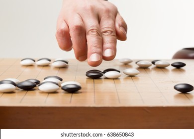 Chinese Go Game Board, Close Up View Of Playing Black And White Stone Pieces, Alphago