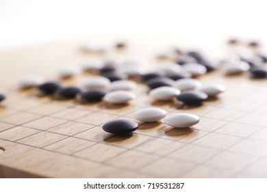 Chinese Go Game Board, Close Up View Of Playing Black And White Stone Pieces