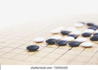 Chinese Go Game Board, Close Up View Of Playing Black And White Stone Pieces