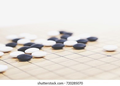 Chinese Go Game Board, Close Up View Of Playing Black And White Stone Pieces