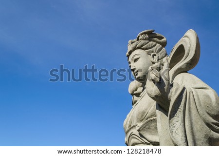 A chinese goddess sculpture with blue sky