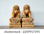 Chinese golden god lion statue is the Asia zen structure ornament emperor in front of the door to protect the bad thing come in.