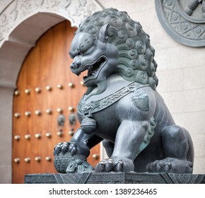 Chinese Guarding Lion In Front Of A Buddhist Temple, China