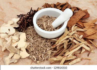 Chinese herb selection with mortar and pestle over mottled background. - Powered by Shutterstock