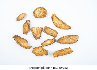 Chinese herbal medicine burdock root slices on white background	
