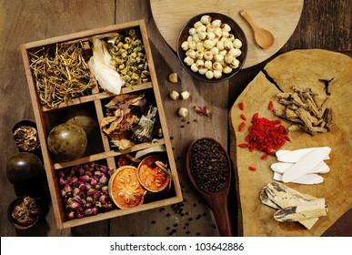 Chinese Herbal Medicine And Flower Tea On Wooden