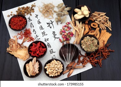 Chinese herbal medicine selection with acupuncture needles and calligraphy script on rice paper. - Shutterstock ID 173985155