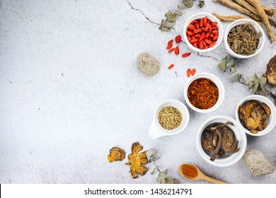 Chinese herbs with copy space and flat lay composition. Variety of dried tea, dried herbal, green, black tea and fruit tea. Table top view.