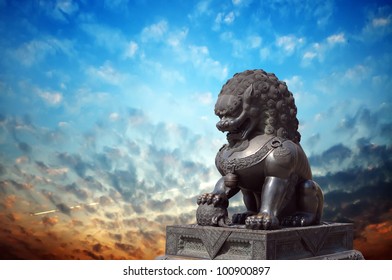 Chinese Imperial Lion Statue At Sunset