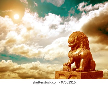 Chinese Imperial Lion Statue At Sunset