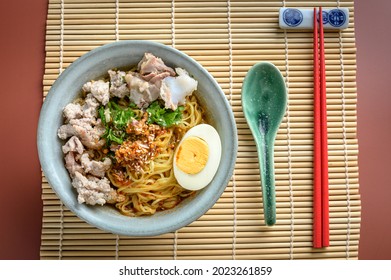 Chinese Or Japanese Famous Traditional Oriental Cuisine, Asian Ramen Noodle With Original Sichuan Chilli Oil, Minced Pork, Boiled Egg Served 