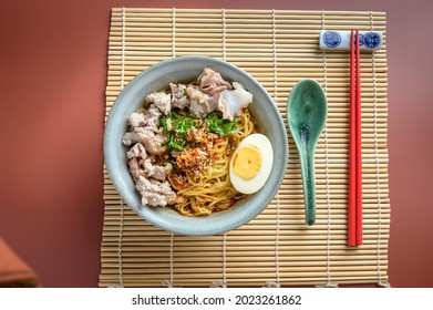 Chinese Or Japanese Famous Traditional Oriental Cuisine, Asian Ramen Noodle With Original Sichuan Chilli Oil, Minced Pork, Boiled Egg Served 