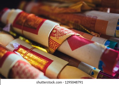 Chinese Joss fortune paper stacked revealing oriental symbols