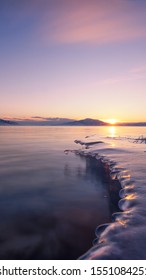 Chinese Landscape: Iceberg And Sunrise In An Ice Block In Sailimu Lake, Xinjiang Province, China