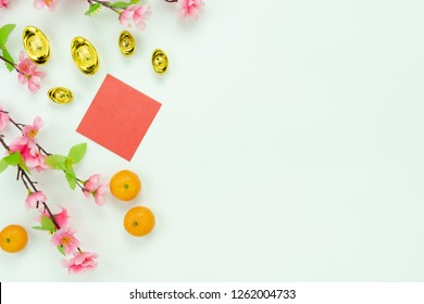 Chinese Language Mean Rich Or Wealthy And Happy.Top View Decoration Chinese New Year & Lunar New Year Holiday Background Concept.Flat Lay Orange With Pink Flower On White Wooden At Home Office Desk.