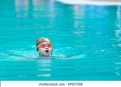 A Chinese Little Kid In The Swimming Pool