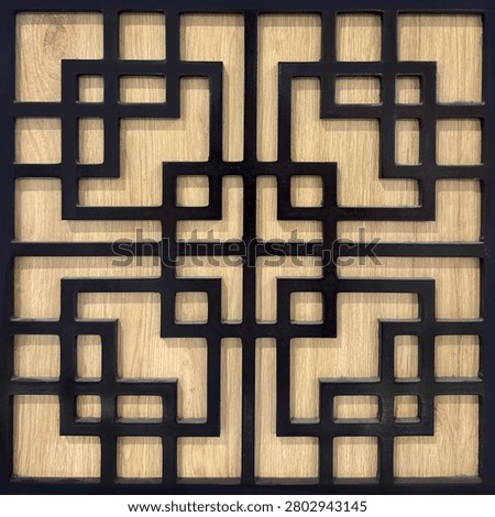 Chinese looking screens pattern in random geometrical oriental pattern. 3D laser cut white paint with wood background. Seamless background texture.