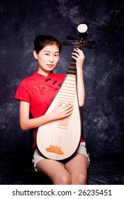 Chinese Lute Player In Red Shirt On Performance