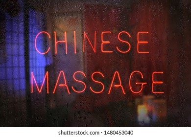 Chinese Massage Neon Sign In Wet Window