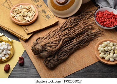 angelica，Ancient Chinese medicine books and herbs on the table.English translation：Emperor's Internal Classic