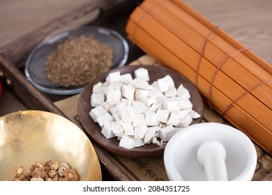 Chinese Medicine On A Plate In A Wooden Box And A Roll Of Bamboo Slips