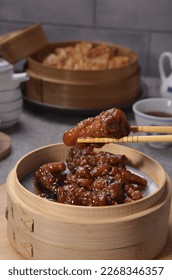 The Chinese name of this dish Chi Zhi Feng Zhao literally means fermented black bean sauce phoenix claws (a romanticised term for chicken feet).  - Shutterstock ID 2268346357