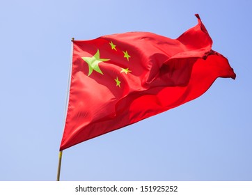 Chinese National Flag Against Blue Sky