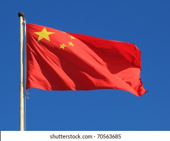 Chinese National Flag With Blue Sky As Background