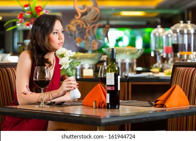 Chinese Nervous, Hoping, Lonely, Dreamy, Heartsick Woman In A Restaurant Waiting For A Date Got Stood Up 