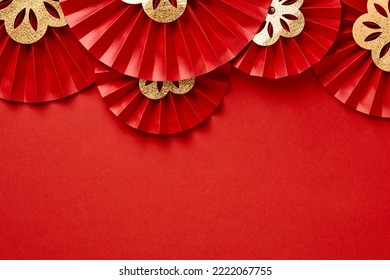 Chinese New Year 2023 year of the rabbit decorations on red background. Red paper fans with golden decorations. Lunar New Year banner template.  Flat lay, top view. - Shutterstock ID 2222067755