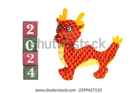 chinese new year concept with hand made dragon and wooden blocks 2024 isolated on white background 