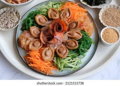 Chinese New Year must have dish. Yusheng aka Prosperity Toss with Abalones. Homemade Cantonese style raw fish salad celebrating with family members