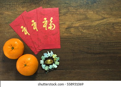 Chinese New Year And Red Envelope (ang Pao) On Wood Table ,top View