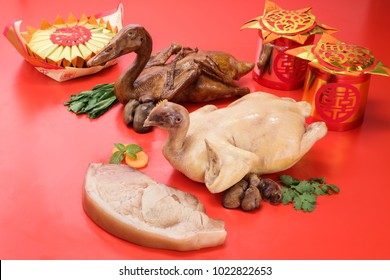 Chinese offering item, duck pork and chicken for celebration of chinese new year. Text appear in image: blessing.