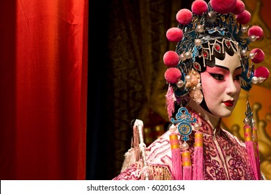 chinese opera dummy and red cloth as text space ,it is a toy,not real man - Powered by Shutterstock