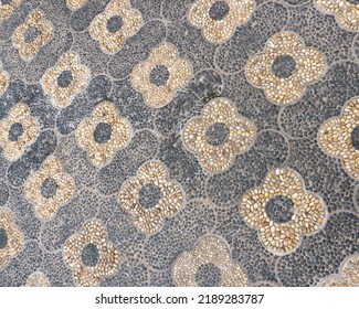 Chinese Pebble Decorative Walkway Of Artistic Designs And Mosaic. Reflexology Paths. Walking Path Made Of Smooth River Rocks Turned On Edge And Closely Packed Together, Embedded In Concrete Substrate.