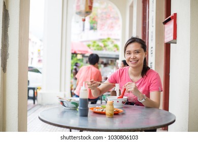 Chinese People Eating Noodles In Penang City George Town.