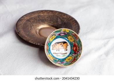 Chinese Porcelain Tea Cup With A Pattern And Image Of A Pig