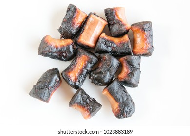 Chinese Sausages Burnt From Over Cooking On White Background.